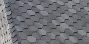 Roof surface with premium shingles in a grey tone